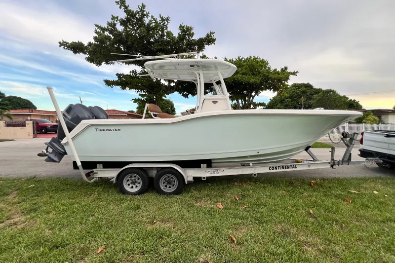 Slide: The Image of 2015 Tidewater 250 CC Adventure boat on trailer, parked outdoors. - 11