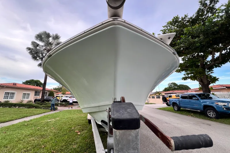 Slide: The Image of 2015 Tidewater 250 CC Adventure boat on trailer in suburban neighborhood. - 7