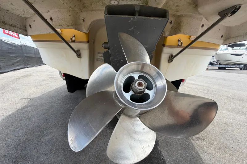 Slide: The Image of Close-up of a 2006 Chaparral Sunesta 236 boat propeller in a marina setting. - 6