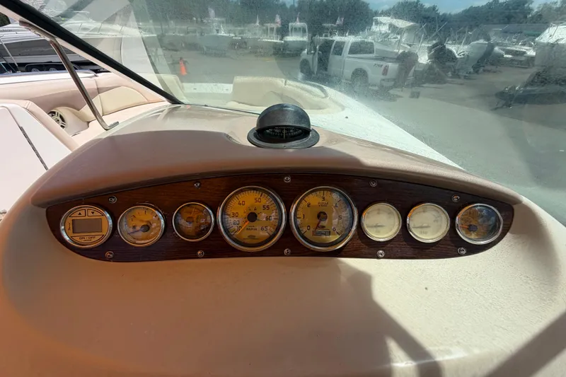 Slide: The Image of Dashboard of a 2006 Chaparral Sunesta 236 boat with gauges and controls. - 30