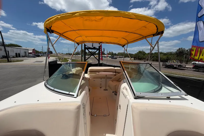 Slide: The Image of 2006 Chaparral Sunesta 236 boat with yellow canopy and spacious seating. - 71