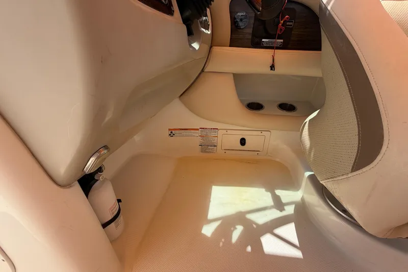 Slide: The Image of Interior of a 2006 Chaparral Sunesta 236 boat, featuring seating and safety equipment. - 34