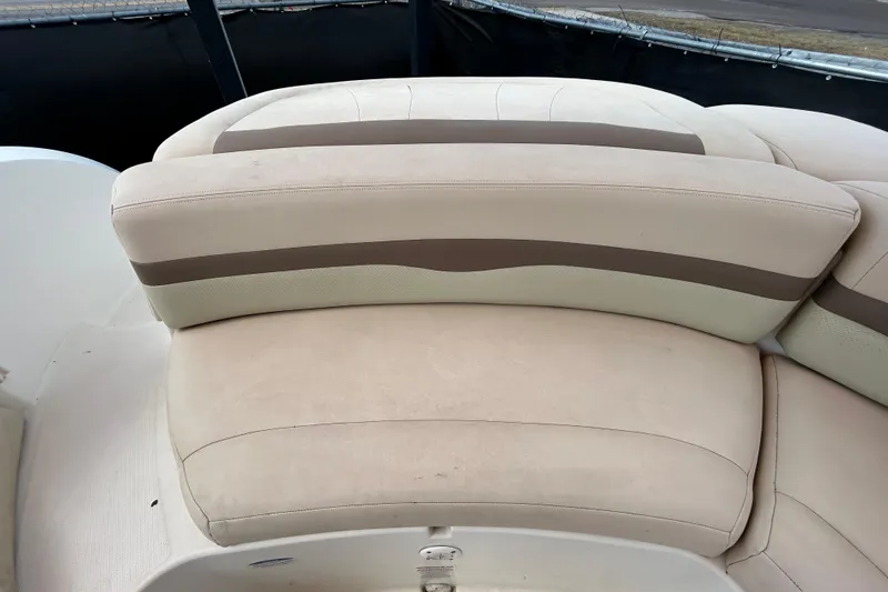 Slide: The Image of 2006 Chaparral Sunesta 236 boat seating with beige and brown upholstery. - 82