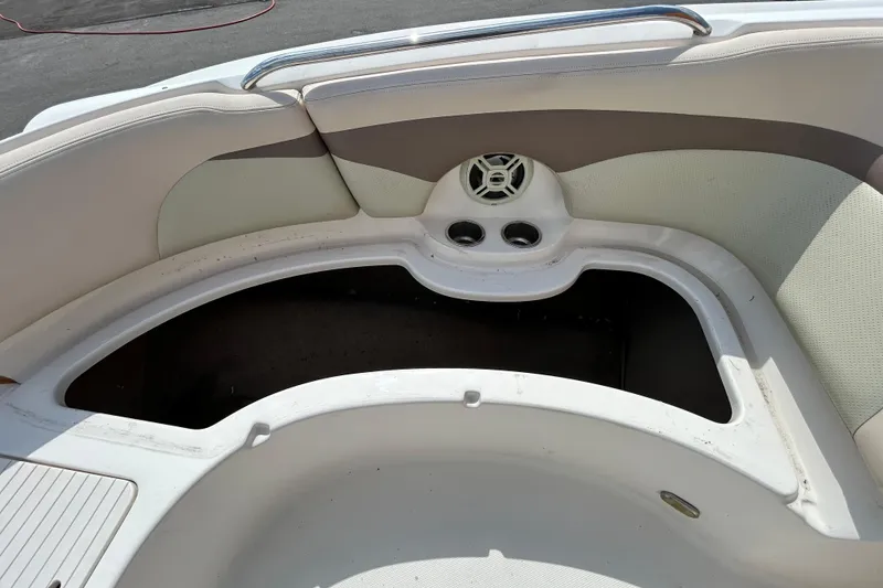 Slide: The Image of 2006 Chaparral Sunesta 236 boat interior with seating and storage compartment. - 57