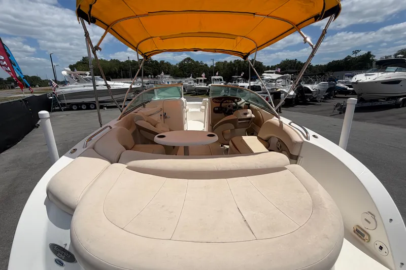 Slide: The Image of 2006 Chaparral Sunesta 236 boat with yellow canopy, spacious seating, and elegant design. - 16