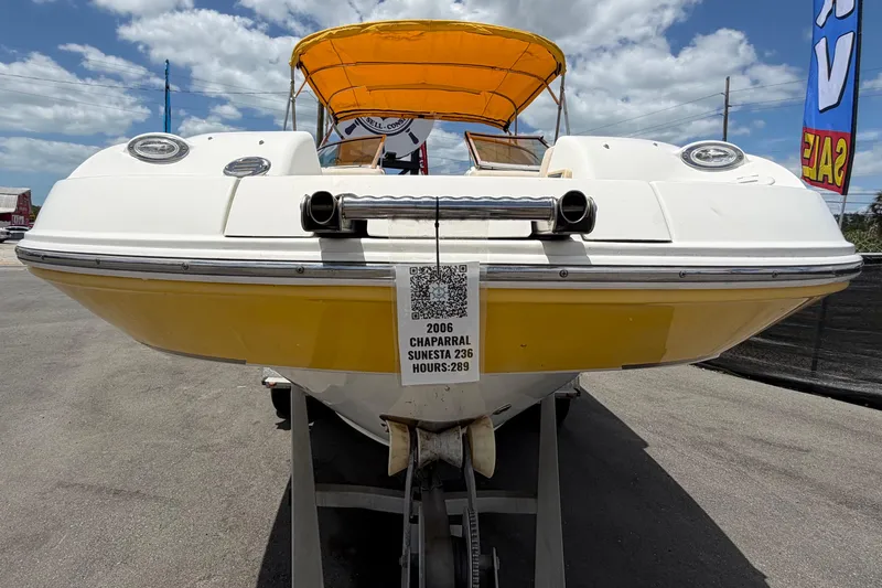 Slide: The Image of 2006 Chaparral Sunesta 236 boat with yellow hull and canopy, displayed for sale. - 12