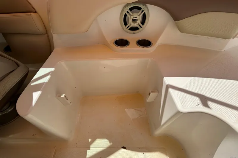 Slide: The Image of 2006 Chaparral Sunesta 236 boat interior with speaker and cup holders. - 79