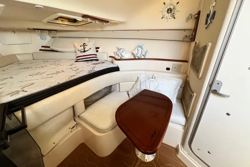 Slide: The Image of Cozy cabin interior of 2006 Grady-White Express 330 with nautical decor and seating area. - 29