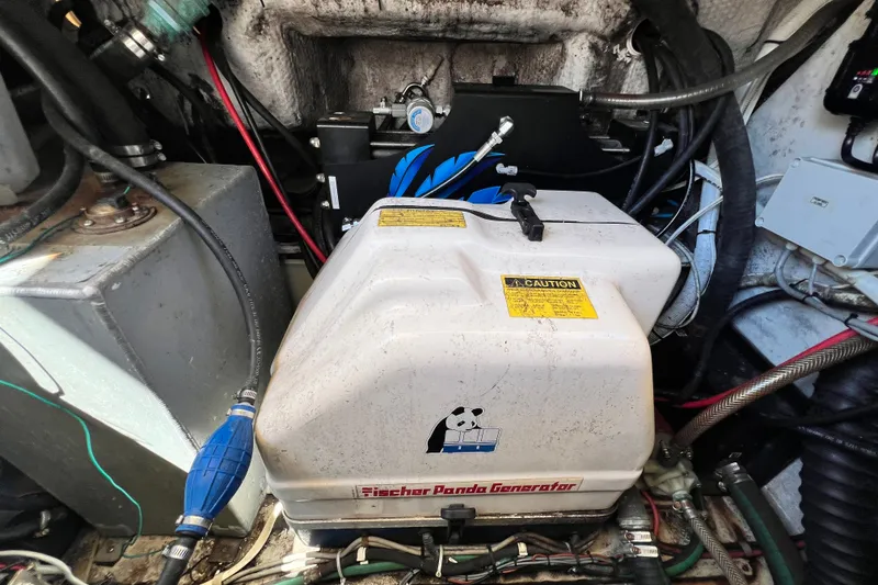 Slide: The Image of Fischer Panda generator in a 2006 Grady-White Express 330 boat engine compartment. - 70