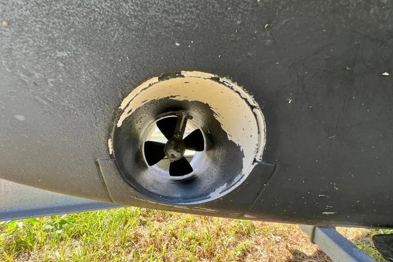 Slide: The Image of Close-up of a 2006 Grady-White Express 330 boat thruster, showing propeller detail. - 67