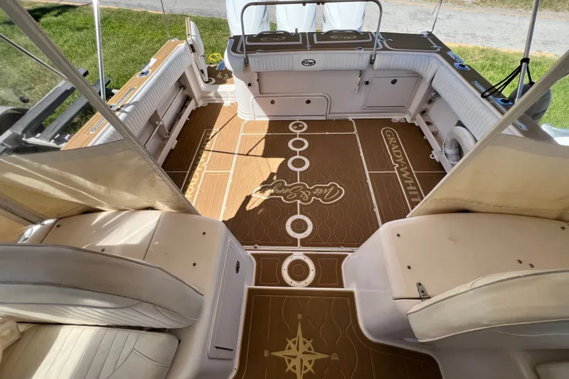 Slide: The Image of 2006 Grady-White Express 330 boat interior with custom flooring and seating. - 37