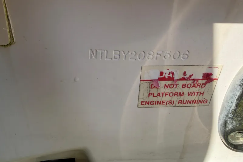 Slide: The Image of 2006 Grady-White Sailfish 282 hull identification and safety warning label. - 51