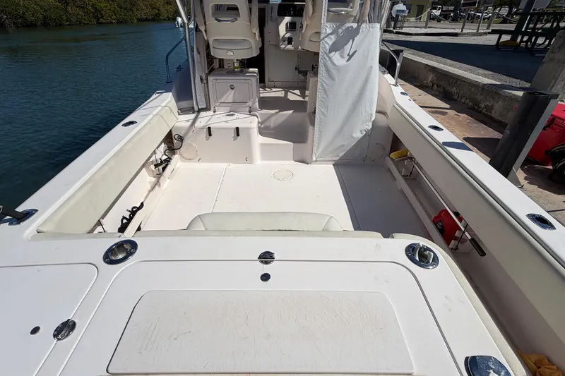 Slide: The Image of 2006 Grady-White Sailfish 282 boat interior, spacious deck with seating and storage. - 72