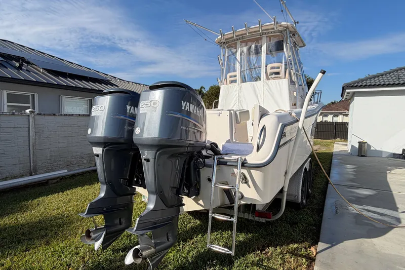 Slide: The Image of 2006 Grady-White Sailfish 282 boat with twin Yamaha 250 engines, parked outdoors. - 53