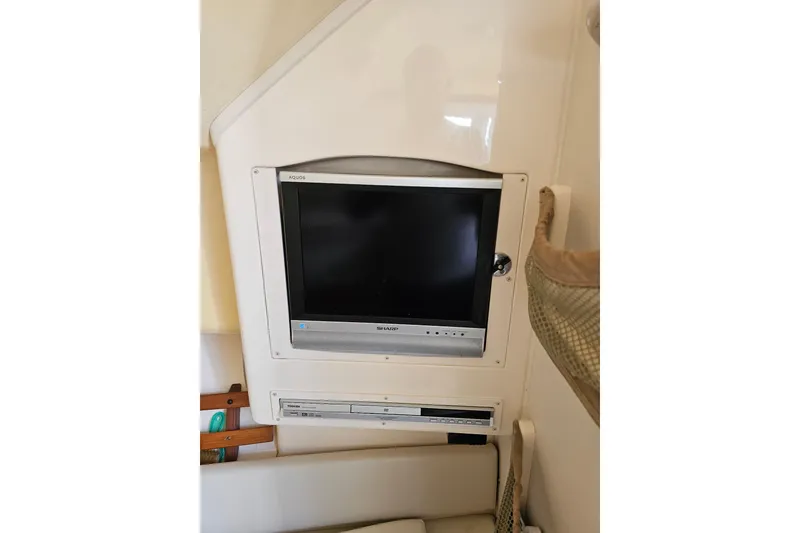 Slide: The Image of 2006 Grady-White Sailfish 282 cabin with built-in Sharp Aquos TV and DVD player. - 29