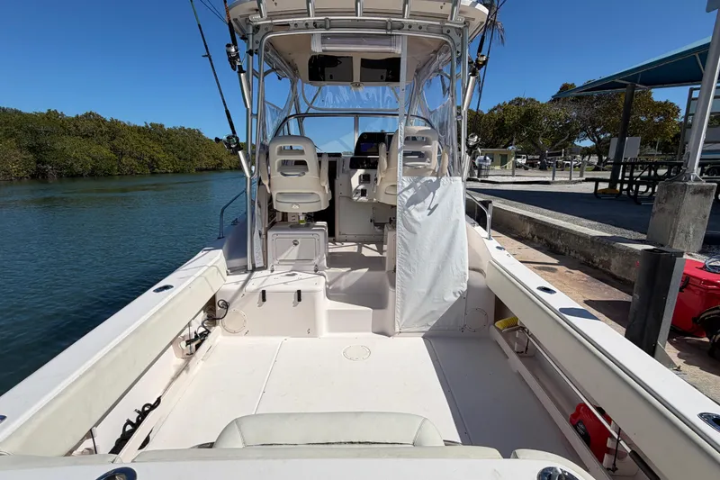 Slide: The Image of 2006 Grady-White Sailfish 282 boat interior at dock, clear sky, calm water. - 71