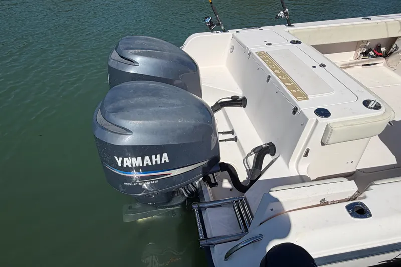 Slide: The Image of 2006 Grady-White Sailfish 282 with twin Yamaha outboard motors on calm water. - 62