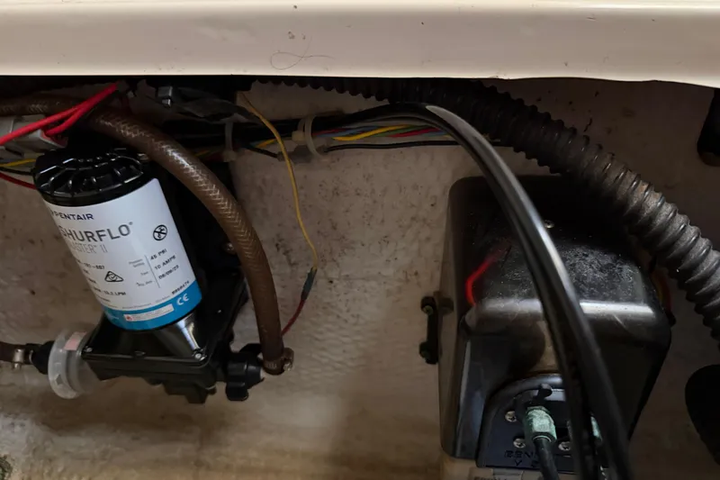 Slide: The Image of Electrical components and wiring inside a 2006 Grady-White Sailfish 282 boat. - 155
