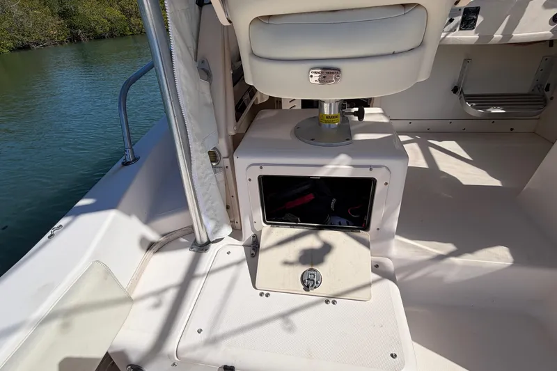 Slide: The Image of 2006 Grady-White Sailfish 282 boat interior with storage compartment and seating. - 87