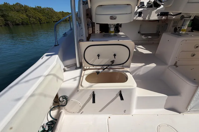 Slide: The Image of 2006 Grady-White Sailfish 282 boat interior with open storage compartment. - 84