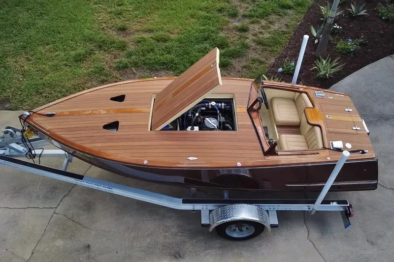 Slide: The Image of Custom Line 17 boat, 2025 model, with wooden deck on a trailer, viewed from above. - 26