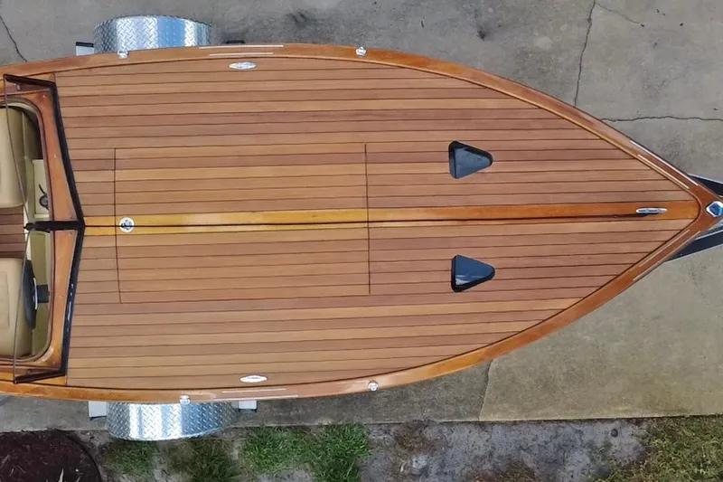 Slide: The Image of Aerial view of 2025 Custom Line 17 wooden boat on trailer. - 12