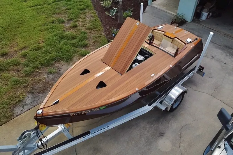 Slide: The Image of Custom Line 17 boat, 2025 model, with wooden deck on a trailer. - 27