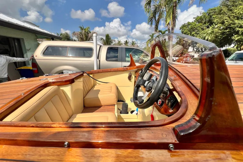 Slide: The Image of Luxurious 2025 Custom Line 17 boat interior with wooden finish and beige seating. - 42