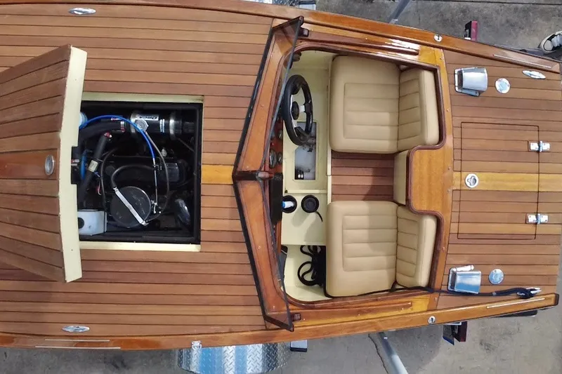 Slide: The Image of Custom Line 17 boat, 2025 model, featuring wooden deck and open engine compartment. - 20