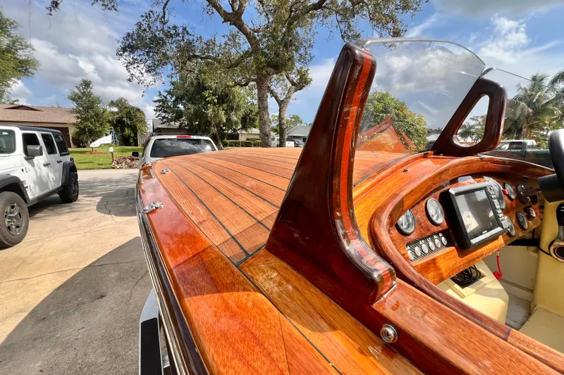 Slide: The Image of Custom Line 17 boat, 2025 model, with polished wooden deck and modern dashboard. - 28