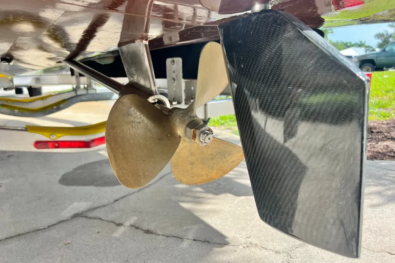Slide: The Image of Propeller and rudder of Custom Line 17 boat, 2025 model, on a trailer. - 36