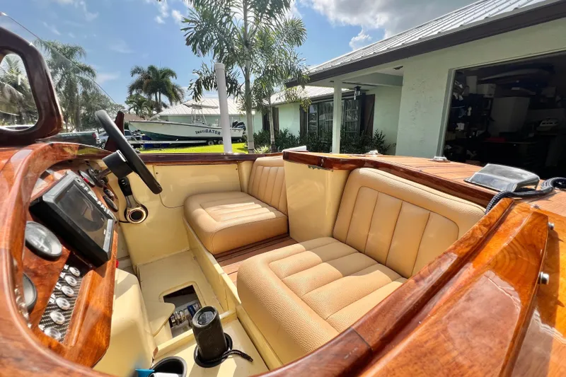 Slide: The Image of Luxurious 2025 Custom Line 17 boat interior with plush seating and polished wood finish. - 32