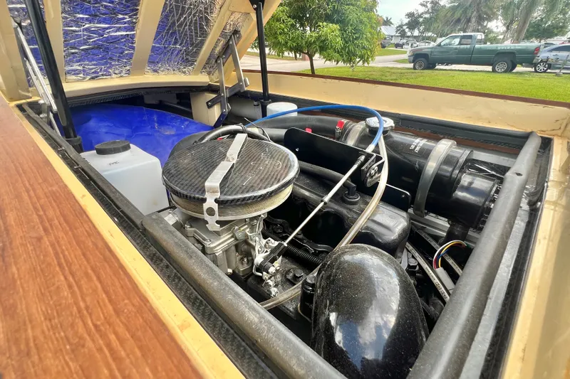 Slide: The Image of Engine compartment of a 2025 Custom Line 17 boat, showcasing detailed mechanical components. - 47