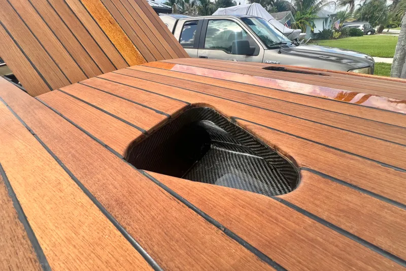 Slide: The Image of Wooden deck with carbon fiber detail on Custom Line 17, 2025 model. - 46