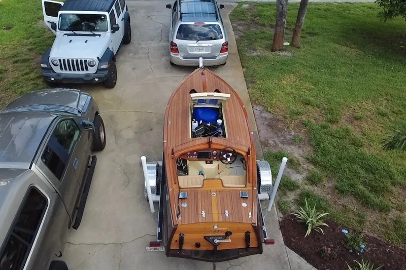 Slide: The Image of Aerial view of a Custom Line 17 boat on a trailer, surrounded by parked vehicles. - 23