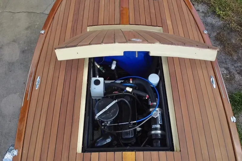 Slide: The Image of Engine compartment of 2025 Custom Line 17 boat with wooden deck. - 19