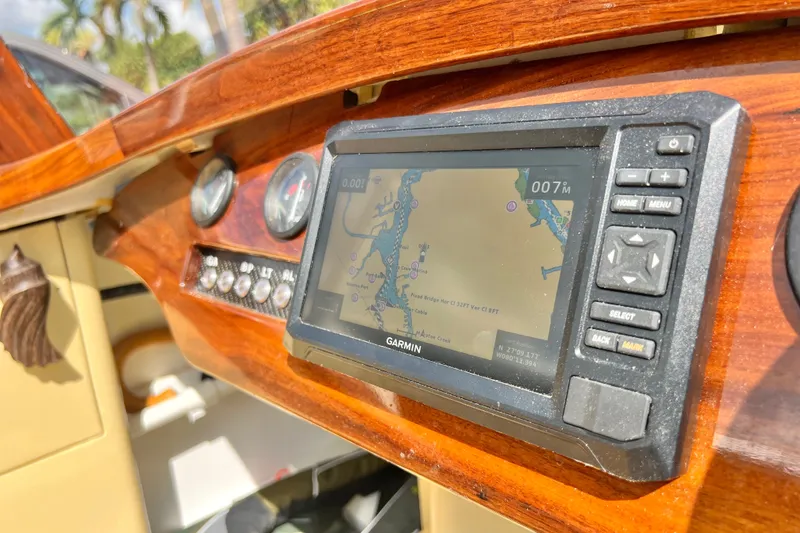 Slide: The Image of Dashboard of a 2025 Custom Line 17 boat with Garmin GPS navigation system. - 49