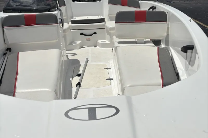 Slide: The Image of 2024 Tahoe T16 boat interior with white and red seating, spacious layout. - 5