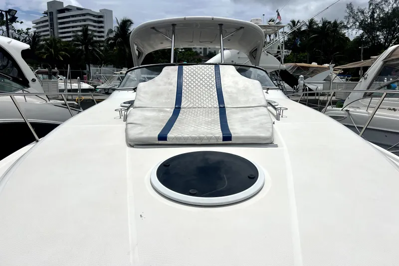 Slide: The Image of 2006 Regal Commodore 3560 IB yacht deck with sunpad, docked in marina. - 21