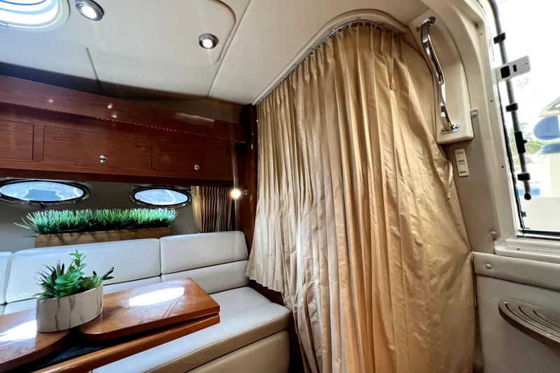 Slide: The Image of Interior of 2006 Regal Commodore 3560 IB yacht with elegant seating and decor. - 79