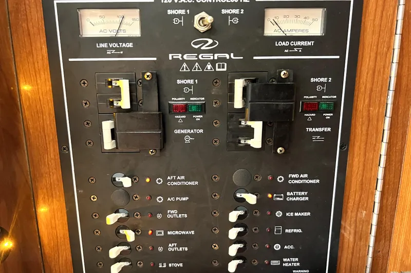 Slide: The Image of Electrical control panel of a 2006 Regal Commodore 3560 IB boat. - 26