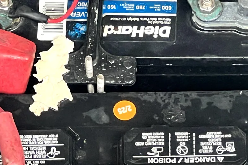 Slide: The Image of Battery compartment of a 2006 Regal Commodore 3560 IB with visible connections and labels. - 61