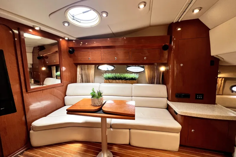 Slide: The Image of Luxurious interior of 2006 Regal Commodore 3560 IB yacht with elegant seating and wooden accents. - 32