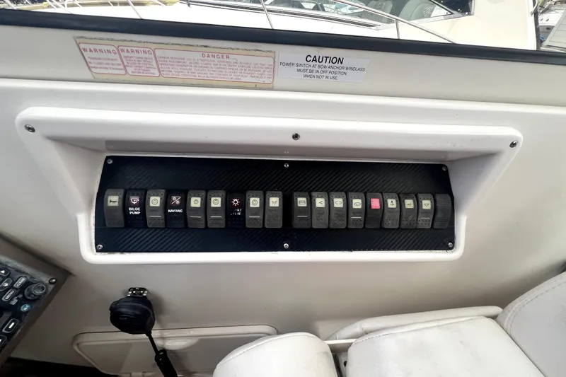 Slide: The Image of Control panel of a 2006 Regal Commodore 3560 IB boat with labeled switches. - 41