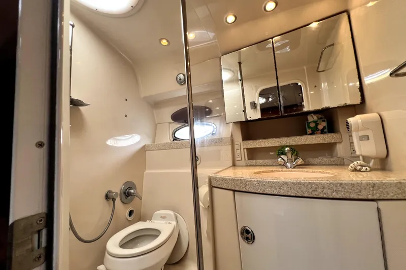 Slide: The Image of Luxurious bathroom in 2006 Regal Commodore 3560 IB yacht with modern fixtures and elegant design. - 86