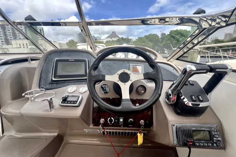 Slide: The Image of Helm of 2006 Regal Commodore 3560 IB with steering wheel and navigation controls. - 46