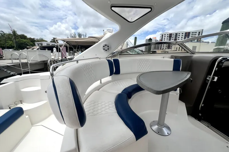 Slide: The Image of Luxurious 2006 Regal Commodore 3560 IB yacht interior with elegant seating and table. - 68