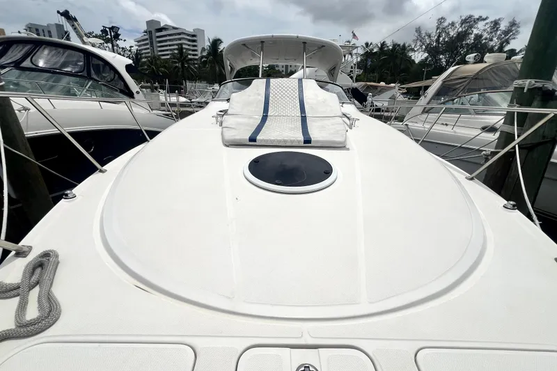 Slide: The Image of 2006 Regal Commodore 3560 IB yacht docked, showcasing sleek deck design and modern amenities. - 59