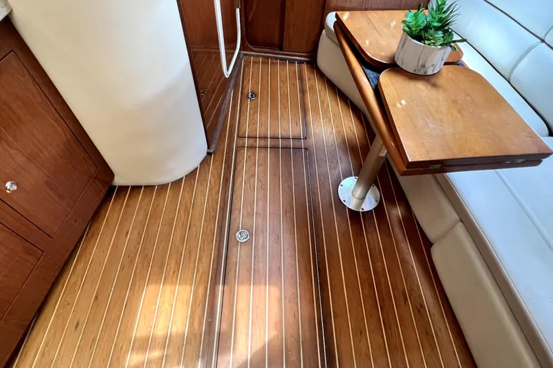 Slide: The Image of Luxurious interior of 2006 Regal Commodore 3560 IB with wooden flooring and elegant seating. - 72