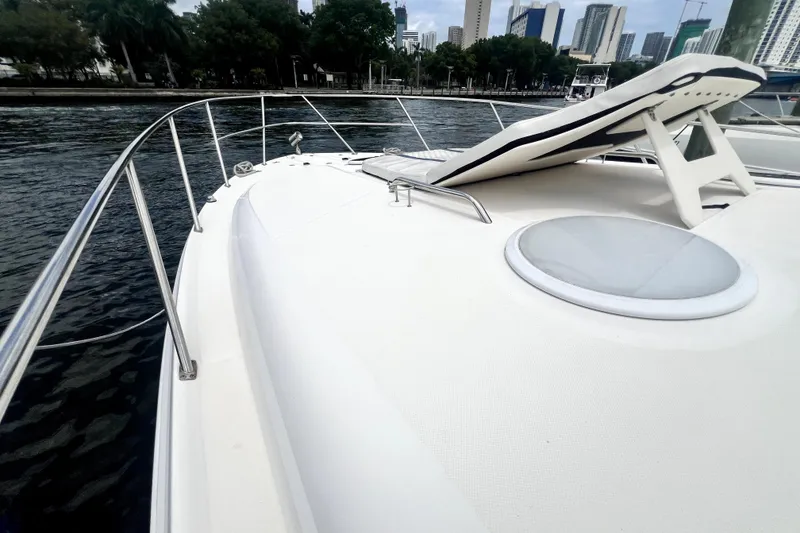Slide: The Image of 2006 Regal Commodore 3560 IB yacht deck with city skyline in background. - 55